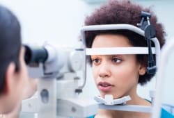 Woman undergoing eye exam
