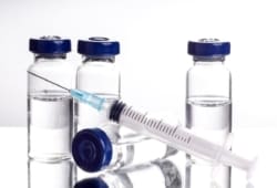 Allergy shots in vials with syringe, ready for injection. Allergy shots can relieve symptoms for people with chronic allergies including mold and pollen from grasses, ragweed and trees.