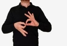 A man using sign language to communicate