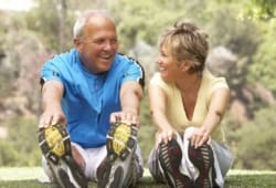 Senior couple exercising in the park