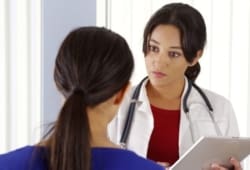 A woman talking to her doctor