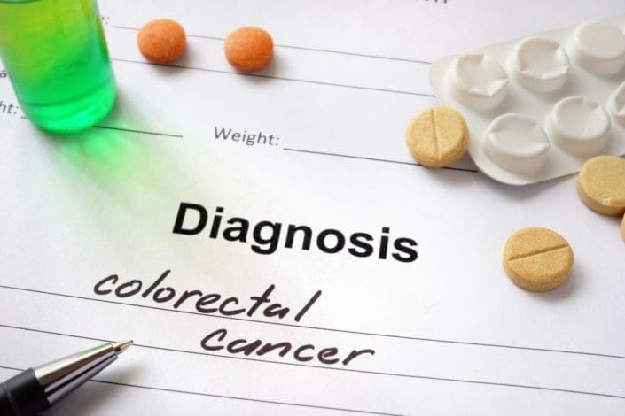 notepad that says diagnosis colorectal cancer