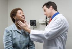 doctor checking lymph nodes of a patient