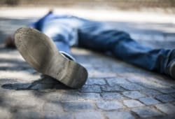 A man has fainted outdoors