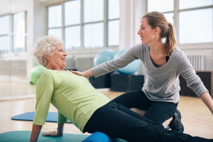 Physical therapist working with a senior woman after a heart attack
