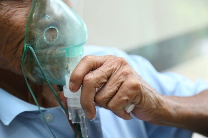 Man wearing an oxygen mask