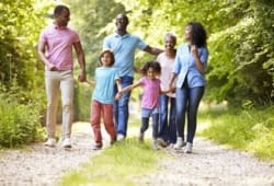 multigenerational family takes a walk on a country road