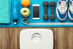 Collection of the tools you need to lose weight, including water, healthy snacks, fitness equipment, and a scale. Talk to your doctor before you begin a new weight-loss plan. They can help you customize a program and safely monitor your progress.