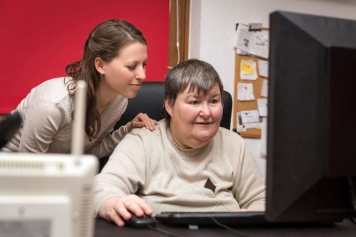 Image result for caregiver mentally disabled on the computer