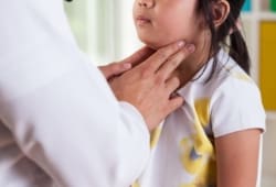 Pediatrician exams a child's lymph nodes. Mumps is a virus that is spread like the common cold. Mumps symptoms can cause you to feel sick for two weeks.