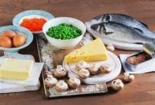 Fish, eggs, dairy products and vegetables sitting on table