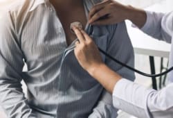A doctor uses a stethoscope while examining a patient. Lupus is a disease that affects your immune system. Lupus symptoms can affect many parts of the body, including the joints, skin, and organs.