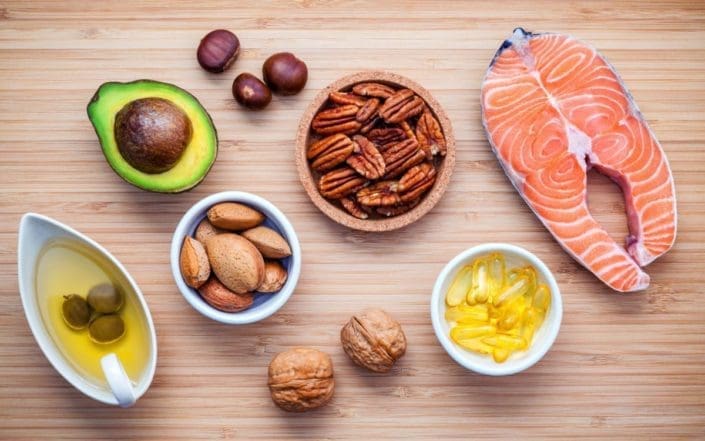 Assortment of foods high in omega-3s and unsaturated fats. Fat should be part of your diet. Your body uses for good fats energy and other health benefits, but bad fats lead to serious health problems.
