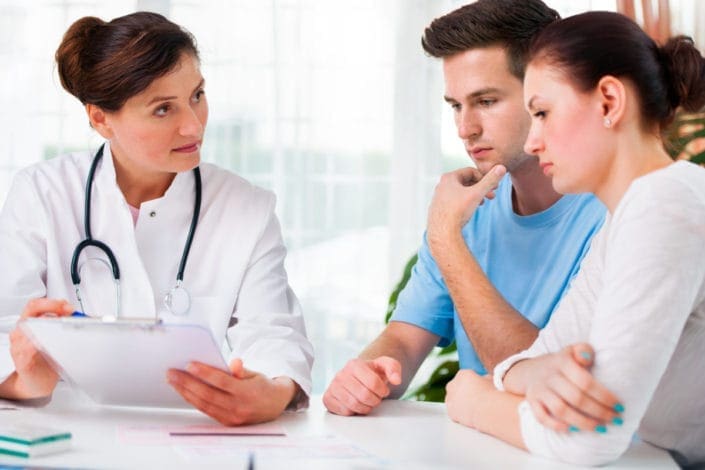 Couple meeting with doctor