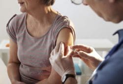 An older woman gets a flu shot. There are a lot of myths surrounding the flu.