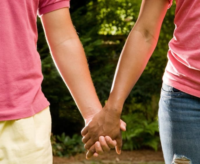 Boy and girl holding hands