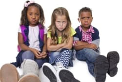 Group of three angry or upset children