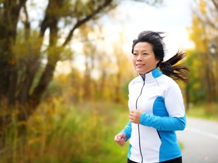 Active woman in her 50s running and jogging.