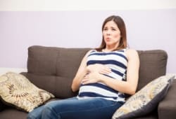 A woman experiencing strong contractions that are 5 to 10 minutes apart