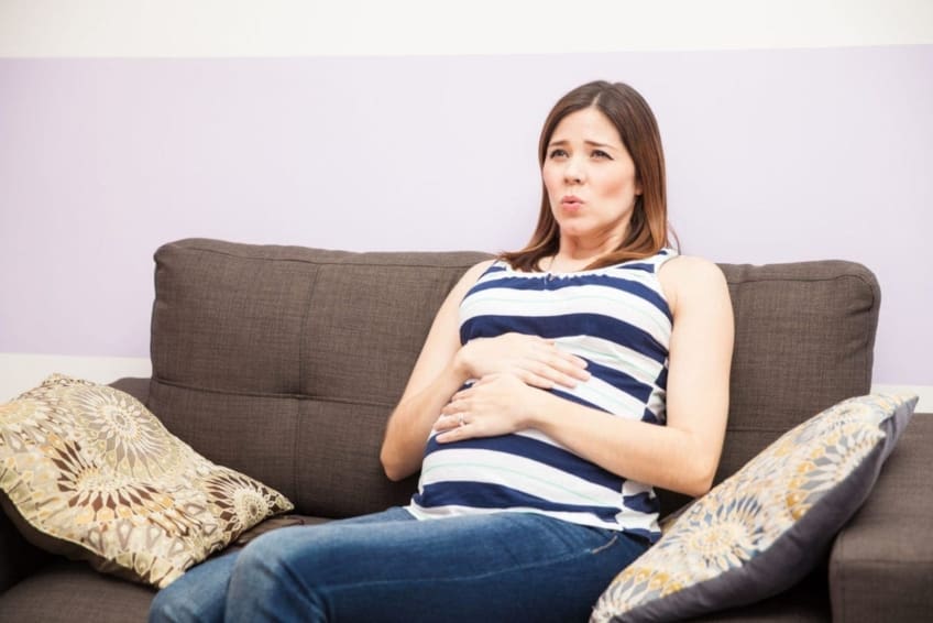 A woman experiencing strong contractions that are 5 to 10 minutes apart