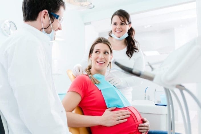 Pregnant woman at dentist’s office for checkup
