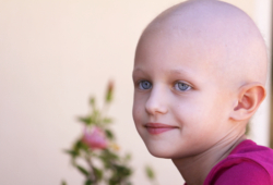 A close-up photo of a young girl without hair. Leukemia is a cancer involving the body’s white blood cells and bone marrow. It is most common in adults over 60, but kids can also get it.