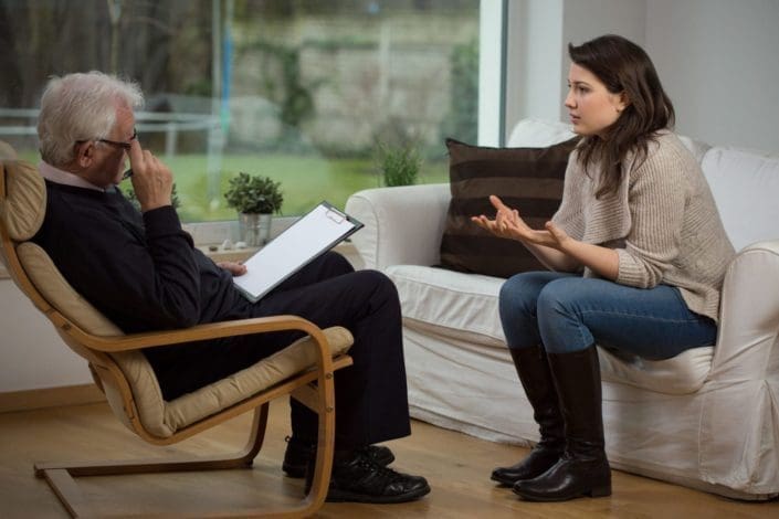 woman telling about her problems in therapy