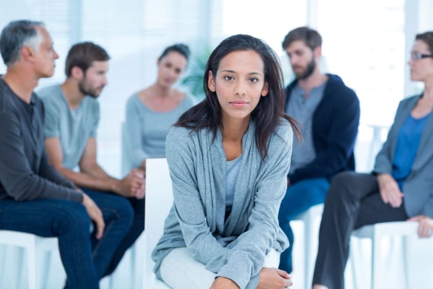 Woman in rehab group at a therapy session.