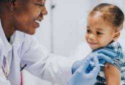 A doctor gives a child a vaccine in the arm. There are many misconceptions regarding vaccines. Use this evidence-based information to avoid common vaccine myths.