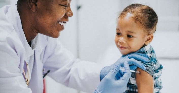 A doctor gives a child a vaccine in the arm. There are many misconceptions regarding vaccines. Use this evidence-based information to avoid common vaccine myths.