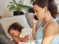 Mother on a phone call about her sick child, looking for medical advice. Ill and unhappy girl with flu and fever while parent mom is talking about online healthcare insurance at home