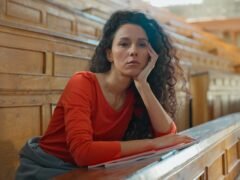 Sad boring tired exhausted Caucasian girl student Hispanic woman Latina lady American female sitting in university college auditorium bored lesson lecture study overworked falling asleep sleep napping