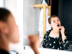Girl brushing her teeth